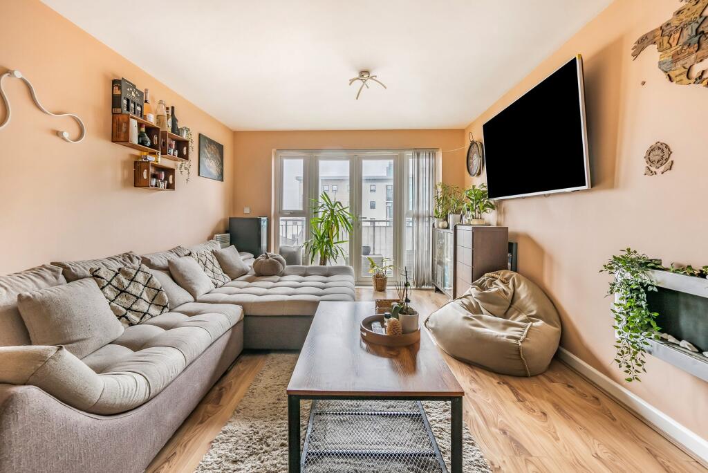Open plan living space with balcony