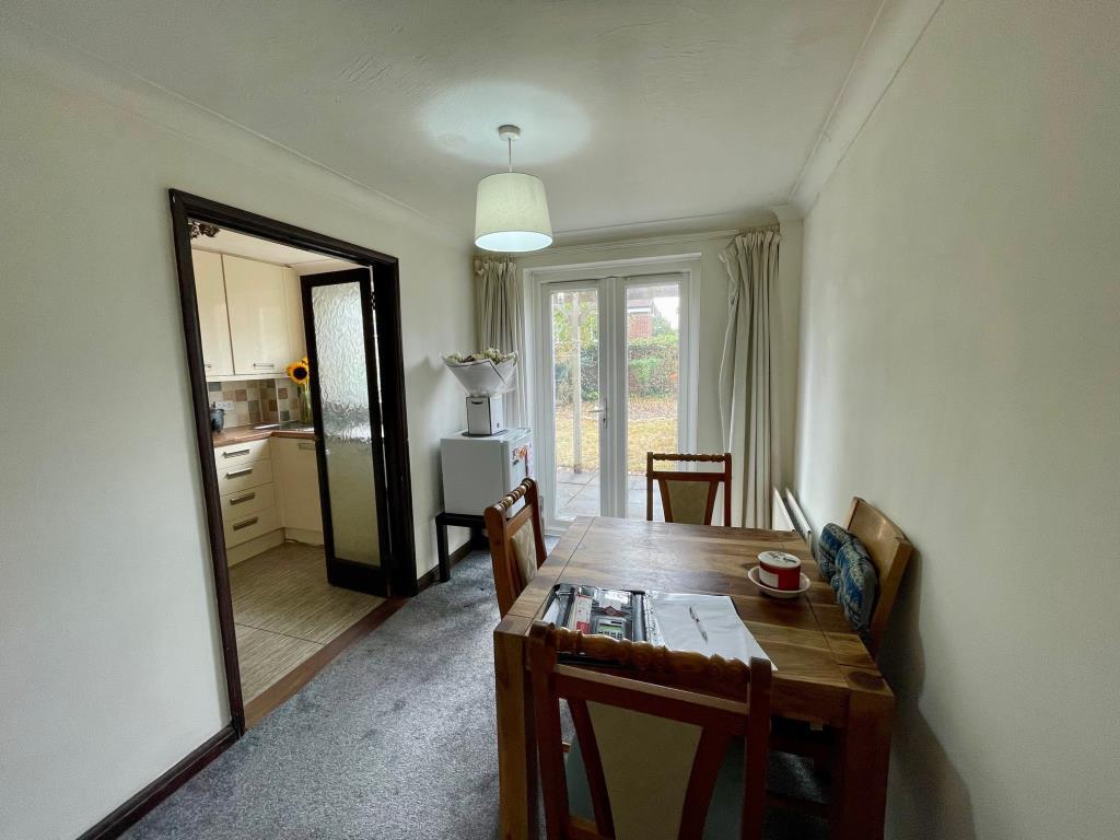 Dining area with door to patio and garden
