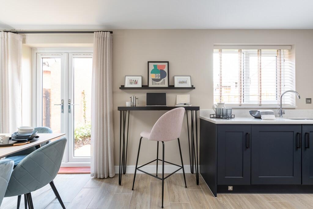 Add a breakfast bar or working space to the kitchen