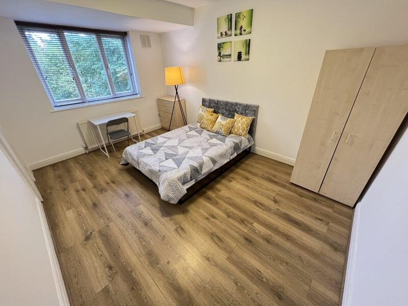 A bright and inviting double bedroom featuring ...