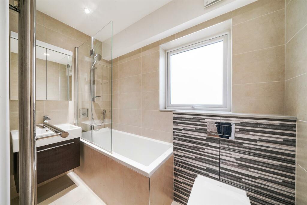 Fully tiled family bathroom