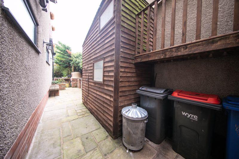 Two storey shed and bin store