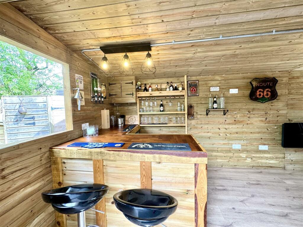 OUTSIDE HOME OFFICE/BAR/HOBBY ROOM