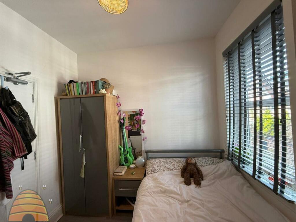A bright and inviting double bedroom featuring ...
