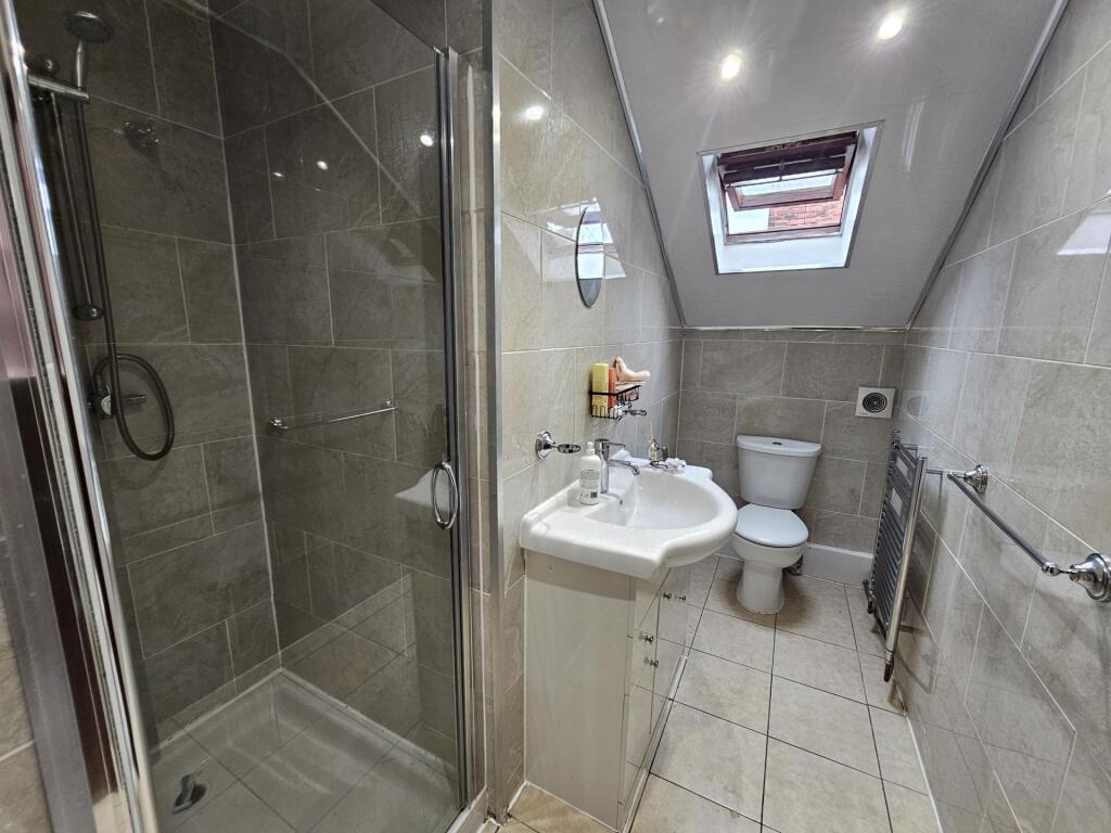 A modern, well-maintained bathroom featuring a ...