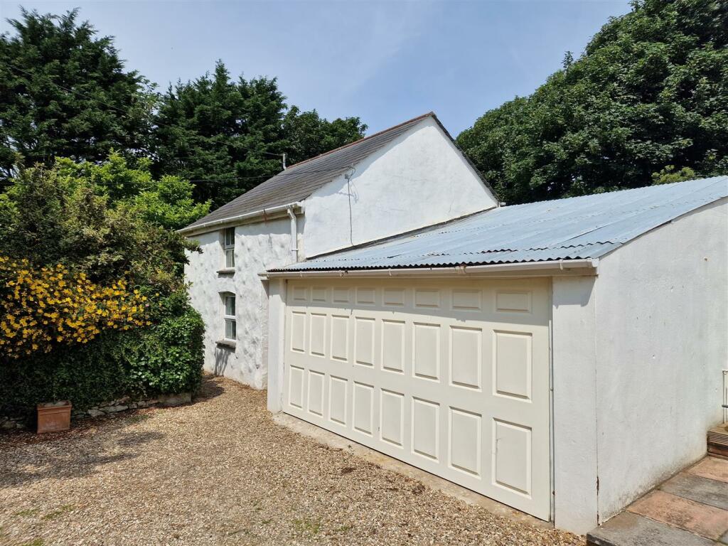 Dilapidated building and garageg