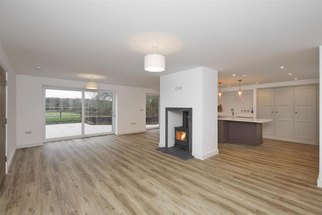 Log burner in kitchen and patio doors to garden