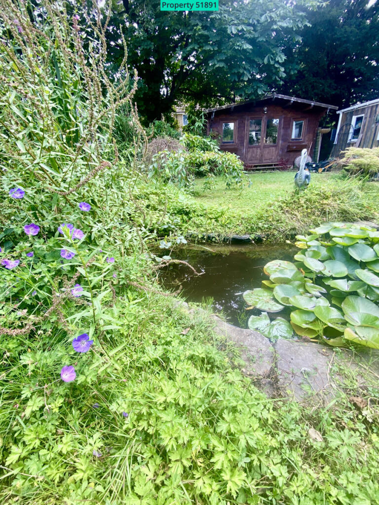 wildlife/fish Pond and view of lodge from bench