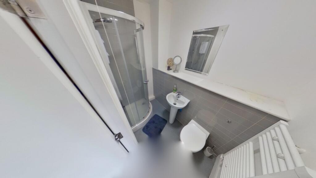 Modern bathroom featuring a sleek shower, styli...