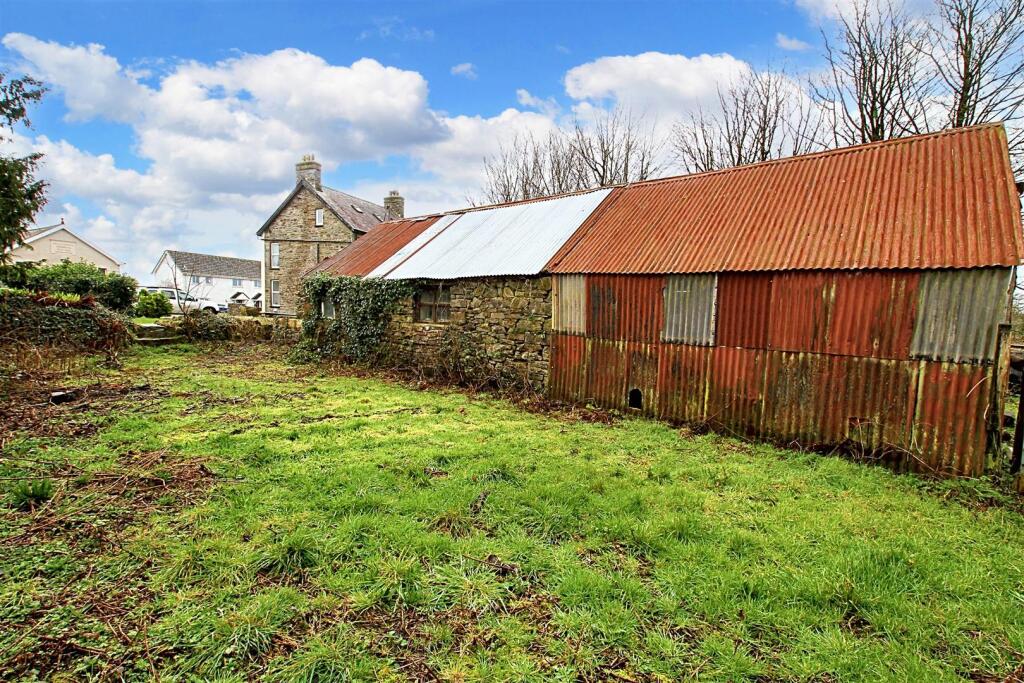 rear of barn and storage shed