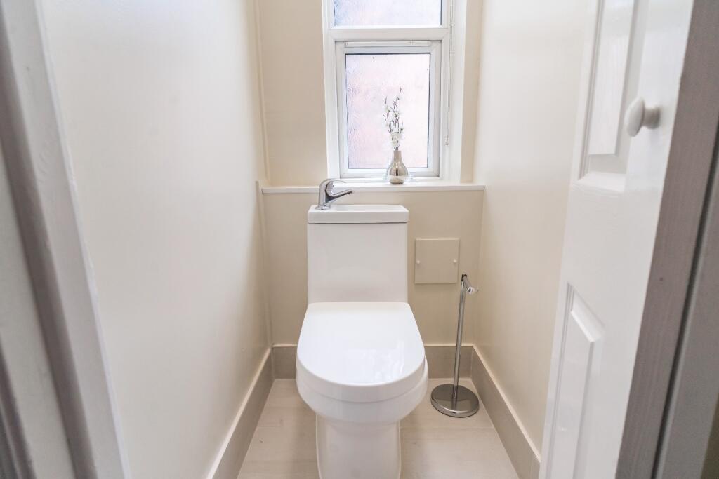 A well-maintained single toilet featuring a mod...