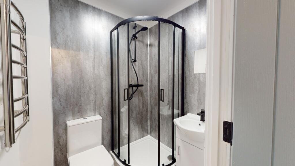 A modern and clean bathroom featuring a stylish...