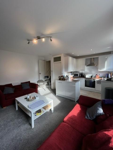 Bright open-plan living area with comfortable r...