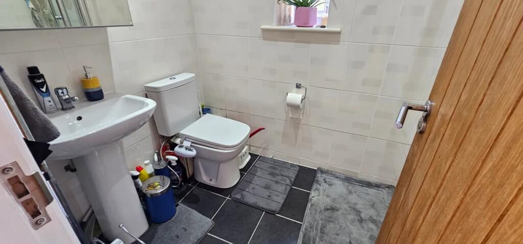A well-maintained bathroom featuring modern fix...