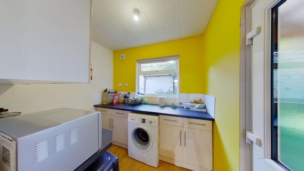 Bright and functional kitchen with vibrant yell...