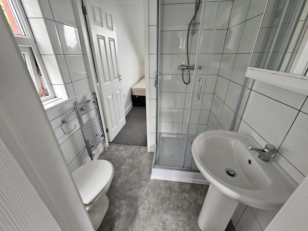 Bright and clean modern bathroom featuring a wa...