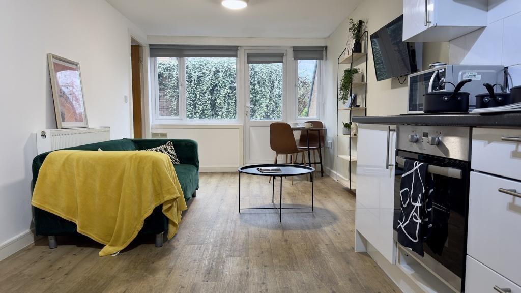 Bright and welcoming living room featuring a la...
