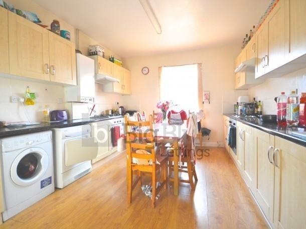 Bright and spacious kitchen with ample cabinetr...