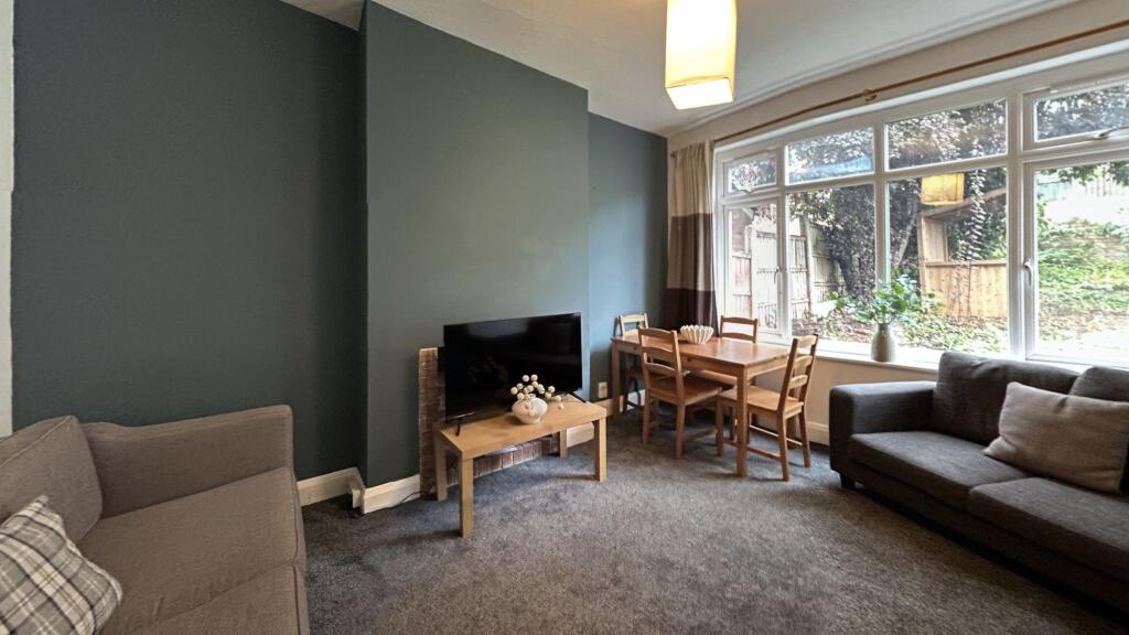 Bright and inviting living room featuring a com...