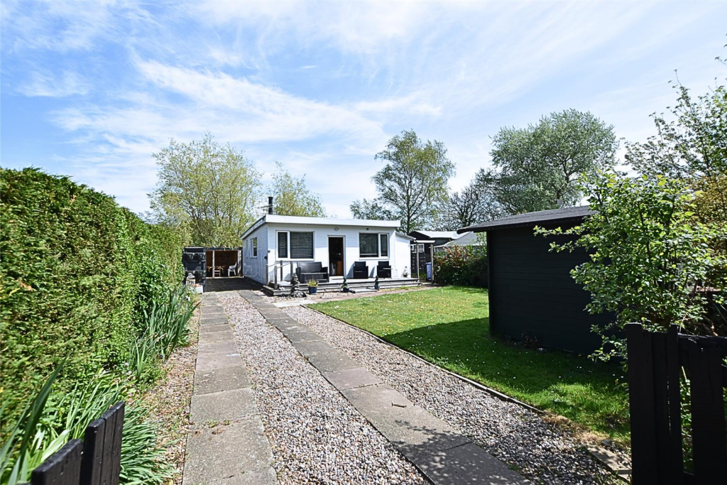 FRONT VIEW WITH GARDEN