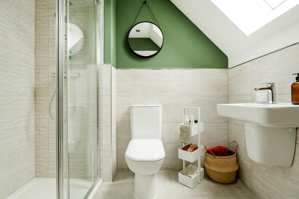 The en-suite is bright with a double shower