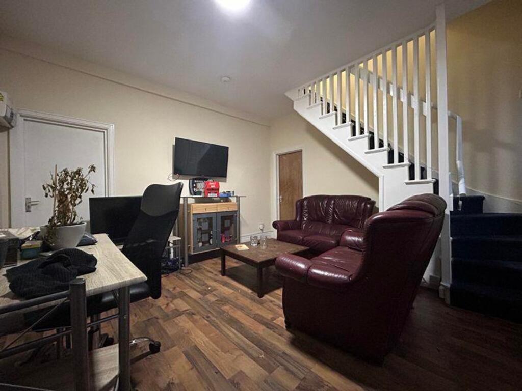 A cozy living room with a welcoming atmosphere,...