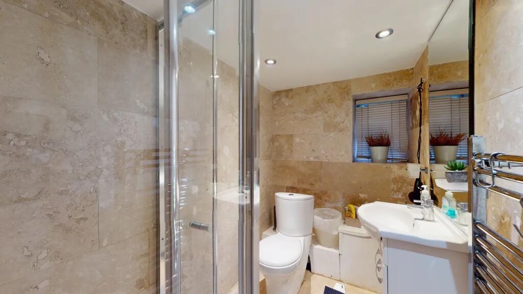 A modern and well-maintained bathroom featuring...