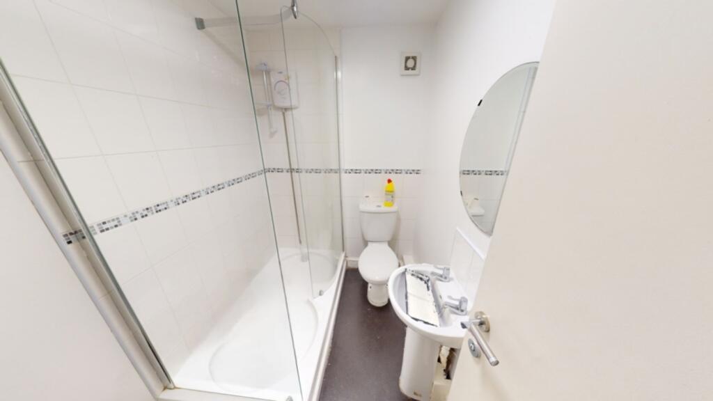 A bright and well-maintained bathroom featuring...