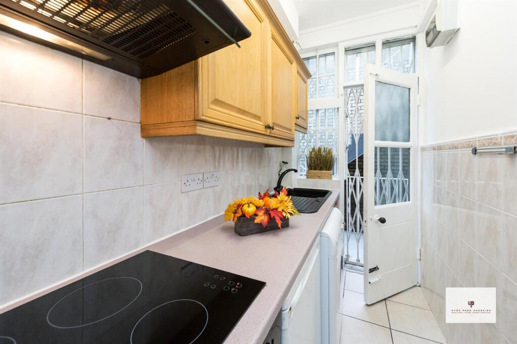 Queen's Court 133-010-010 Logo.jpg