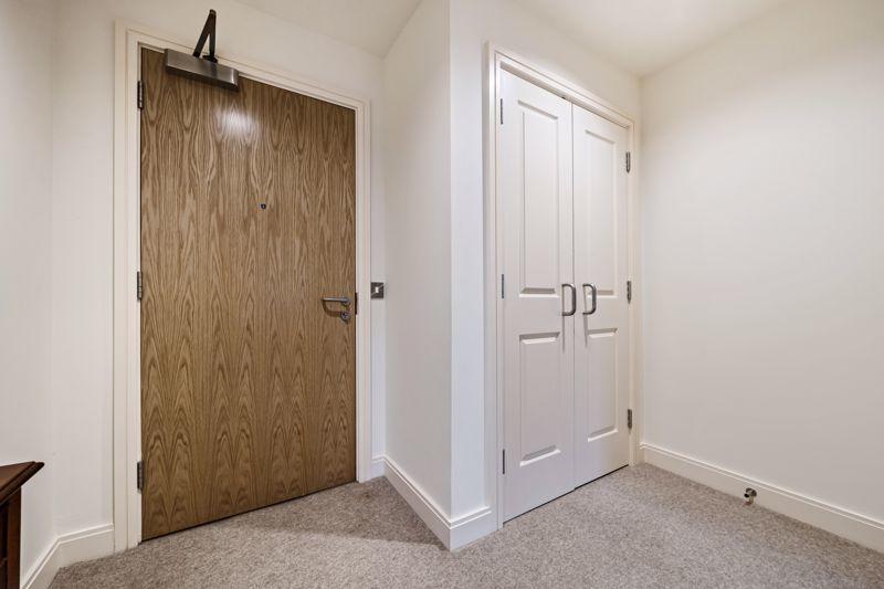 Entrance hall with storage cupboard