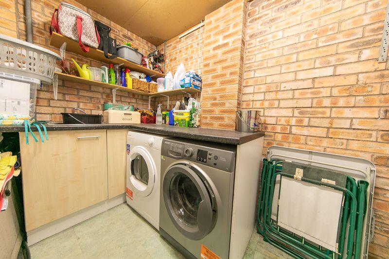 Garage rear utilities space