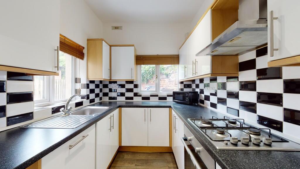 Bright and modern kitchen featuring ample count...