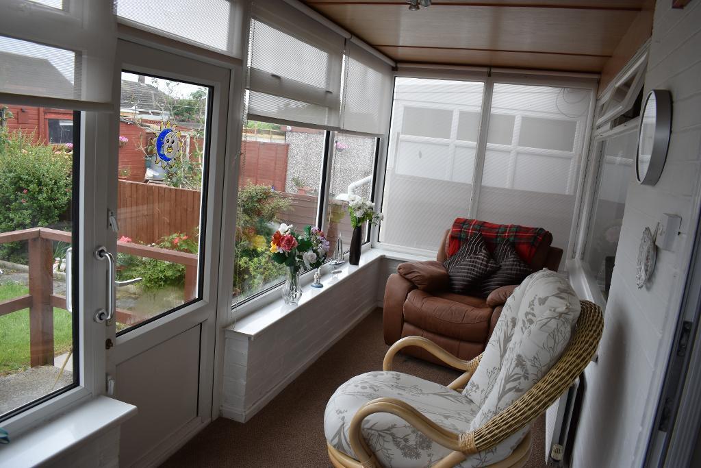 Large conservatory overlooks rear garden