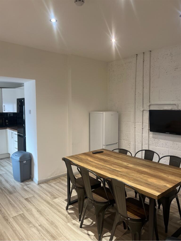 Spacious communal lounge area featuring a large...