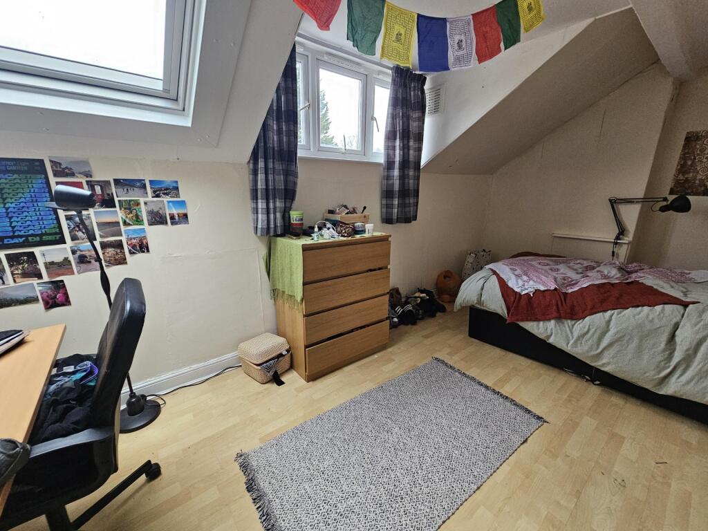 Cozy furnished bedroom with a double bed, large...