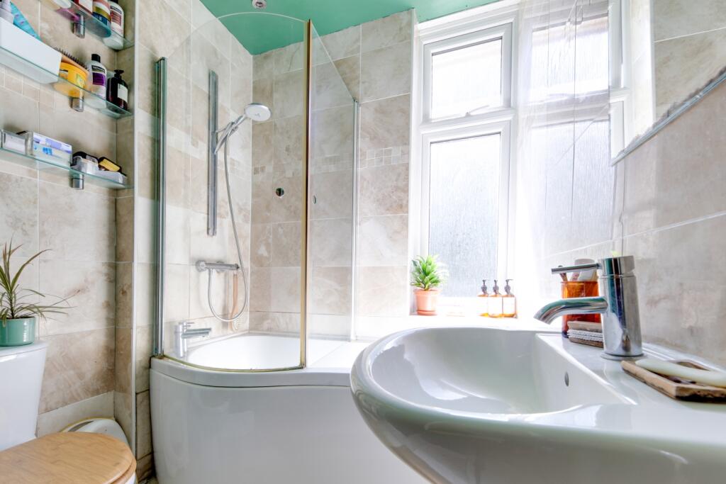Family bathroom with airing cupboard and P bath sh