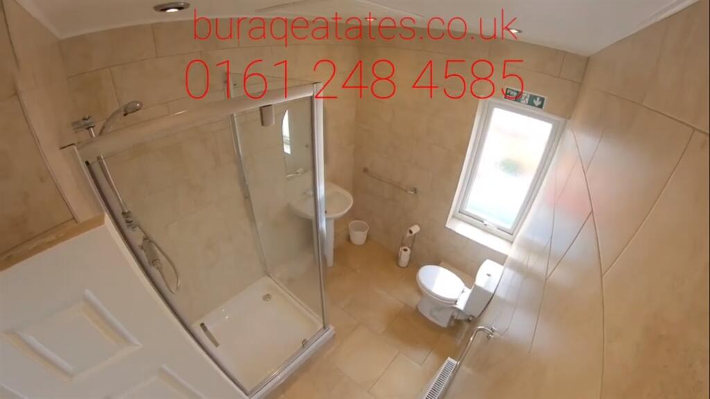 Bright and modern bathroom suite featuring a sp...