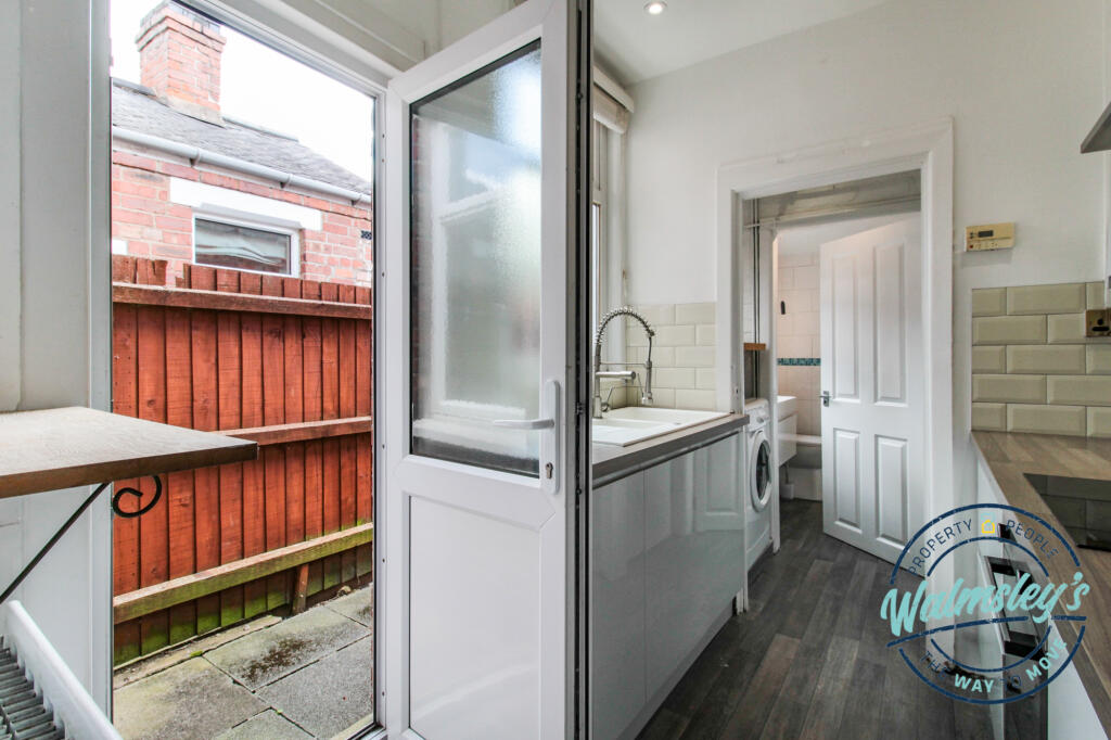 Kitchen with door to side return