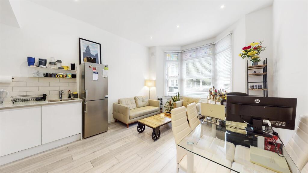 High ceilings in reception room into bay window