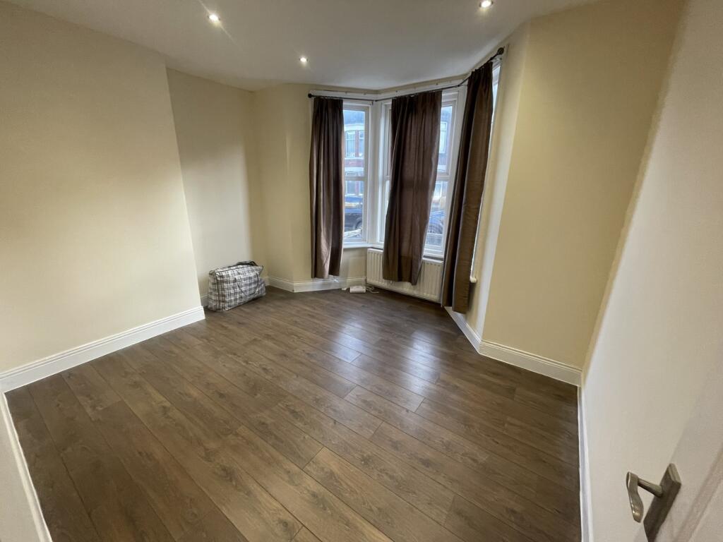 A spacious and well-lit large double bedroom, p...