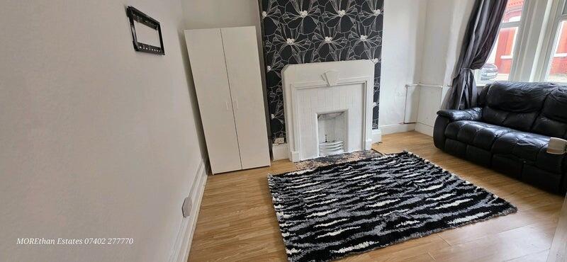 Bright and inviting living room featuring a com...