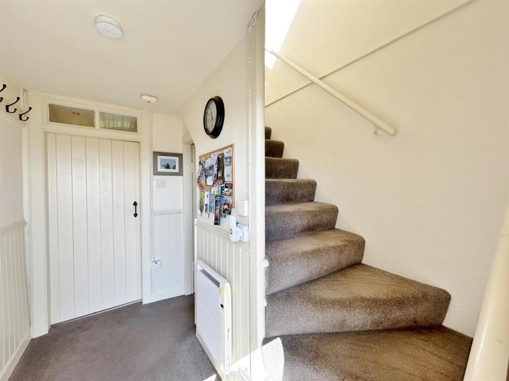 Entrance hallway stairs up