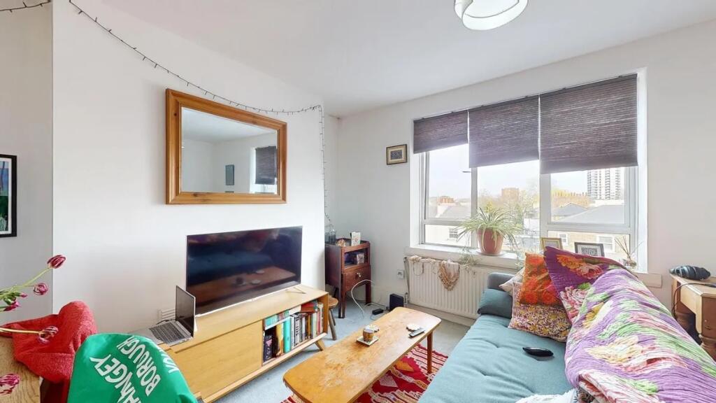 Bright and inviting living room featuring a lar...