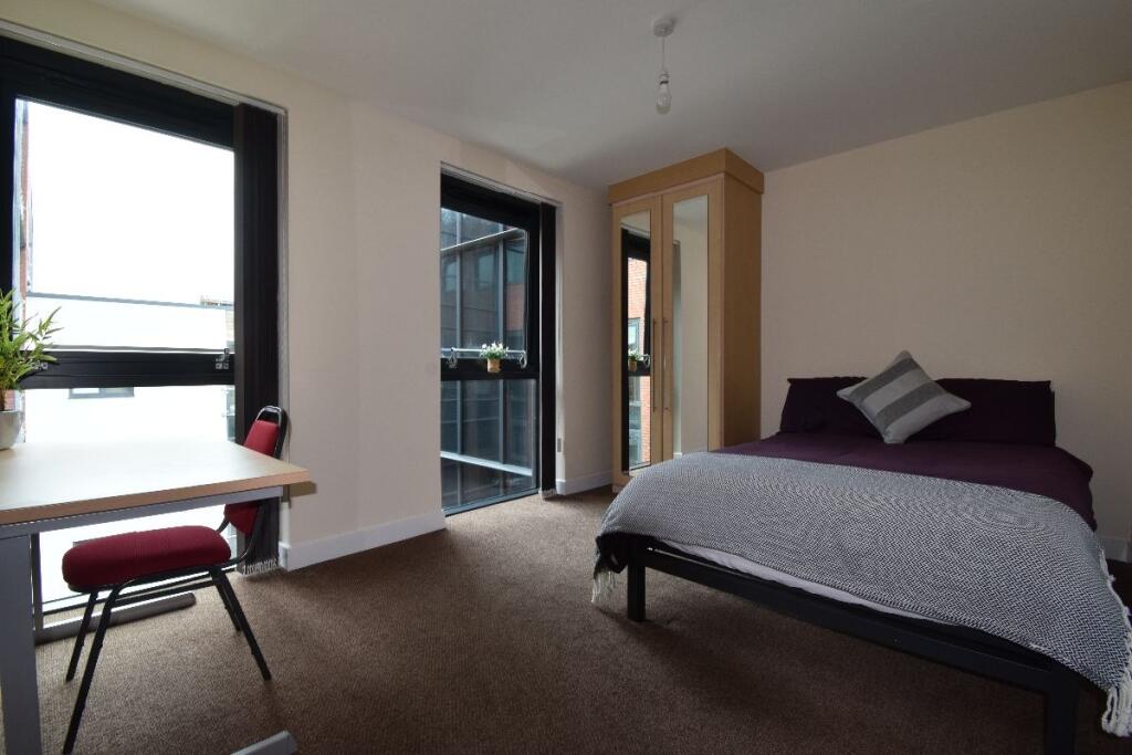 Bright and inviting double bedroom featuring a ...