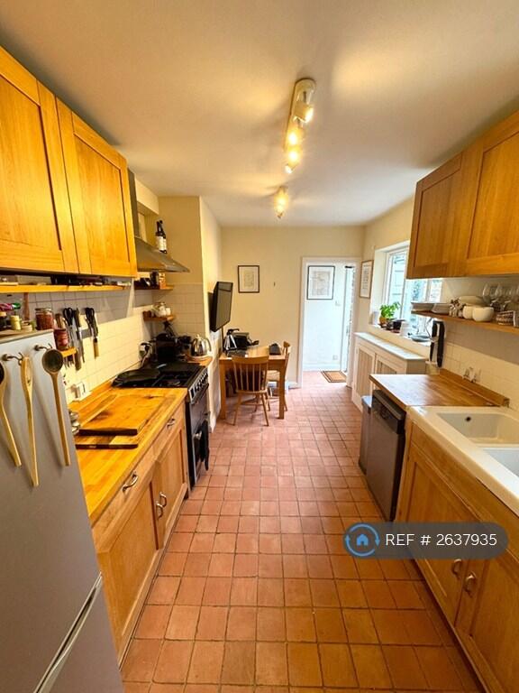 Kitchen And Breakfast Table/Office From Corridor