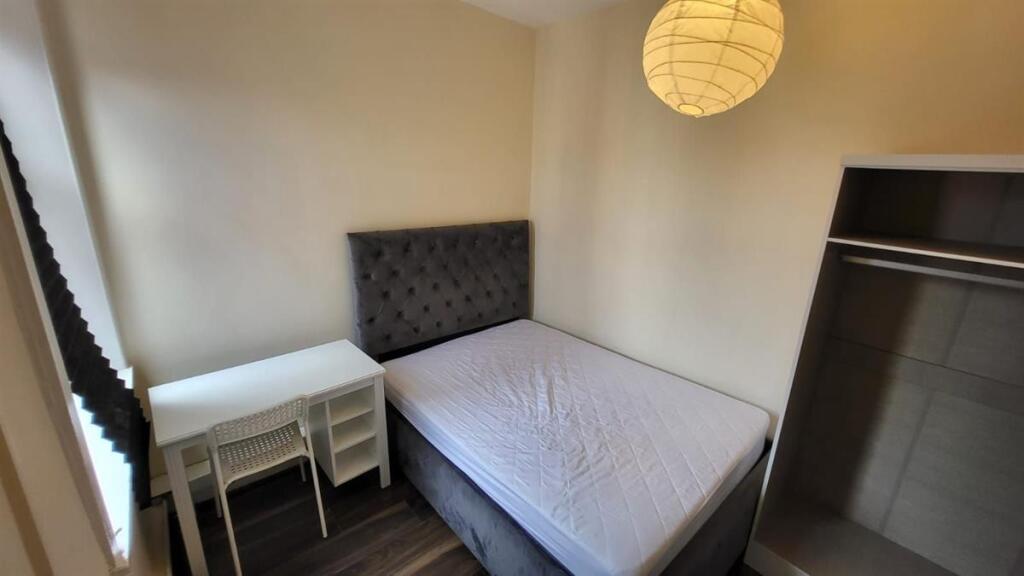 A simple, tidy bathroom with a basic WC and a c...