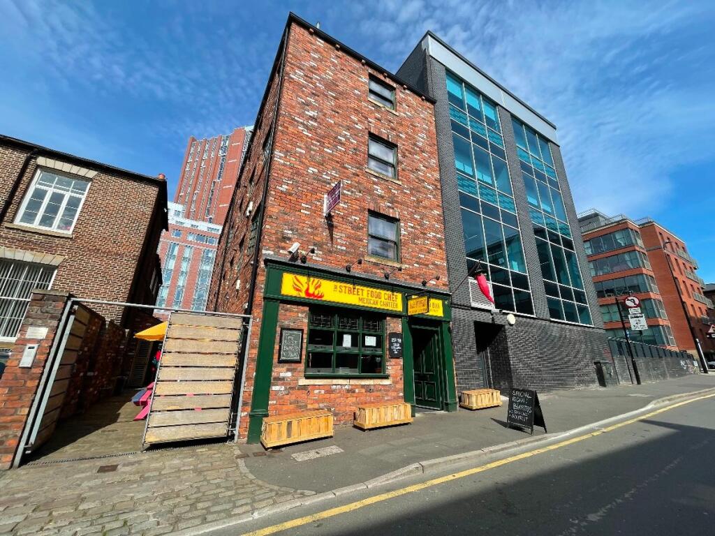 A bright and well-maintained street view of a c...