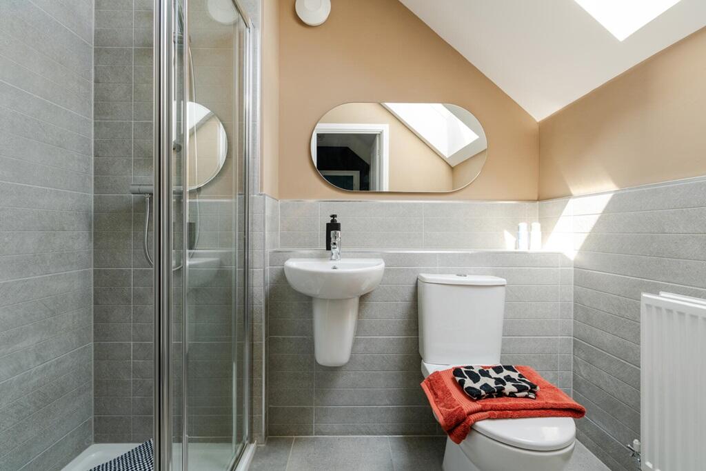 The top floor is complete with a shower room