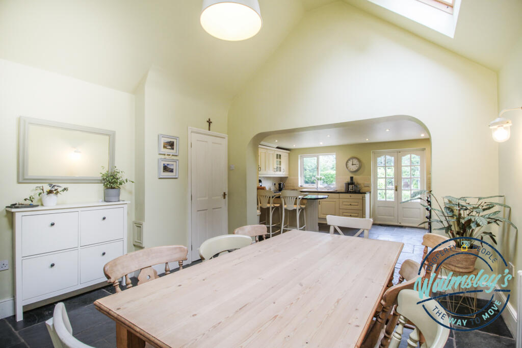 Right wing kitchen dining room with vaulted ceilin