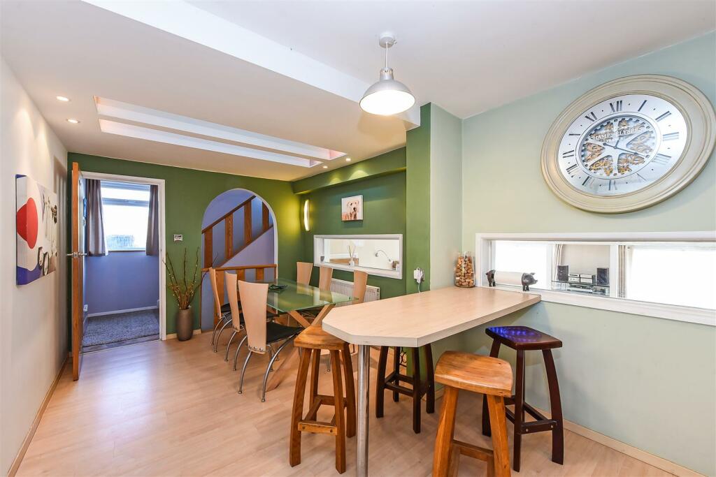 Dining Area and Breakfast Bar With Views Through T